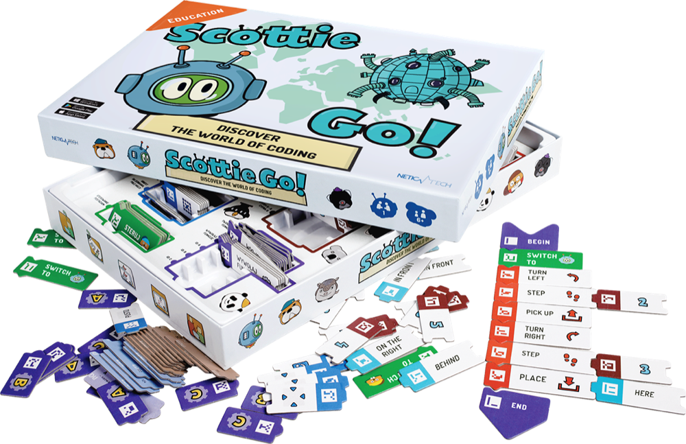 Scottie Go! Edu box open, showing the 179 cardboard programming blocks, background board, and a phone running the companion app